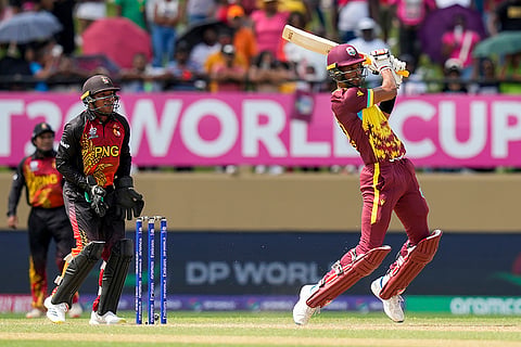 Roston Chase plays a shot against PNG